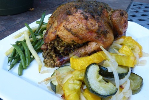 herb roasted chicken with squash and green beans on serving platter