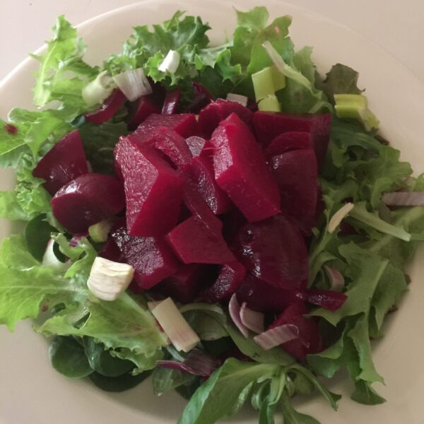 Spiced pickeled beets on salad