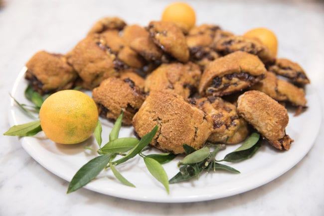 freshly made Rugelach on plate with leaves and lemon