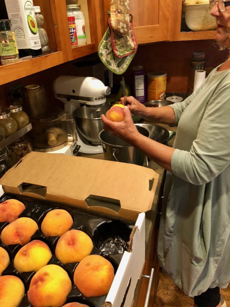 fresh peaches being prepared for dehydrator