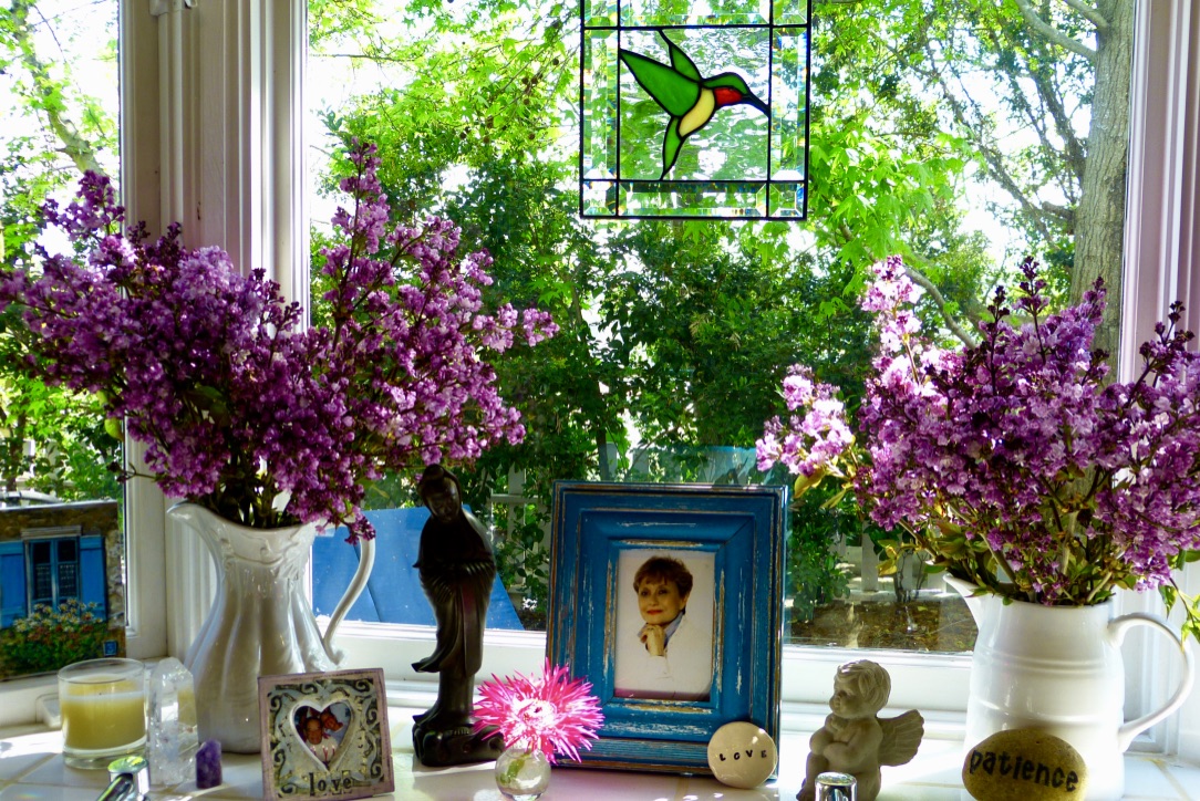 kitchen altar with photo and flowers