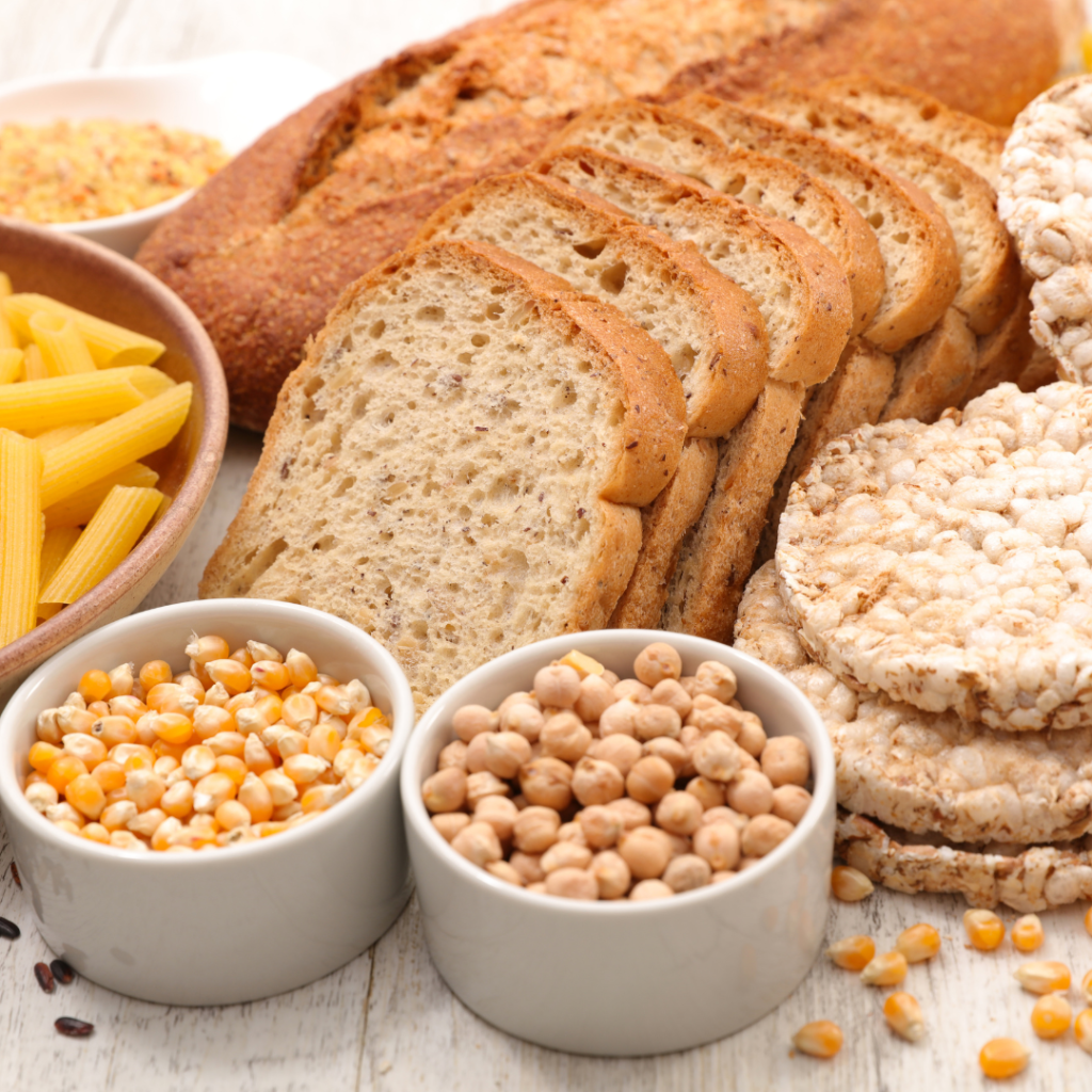 bread, corn, beans and pasta on a table